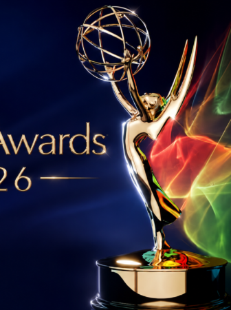 Golden Emmy Award statue raised in victory on a dark blue background with colorful light trails, and text 'Emmy Awards 2026' on the left.